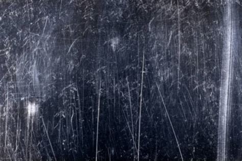 Scratches metal to make art .